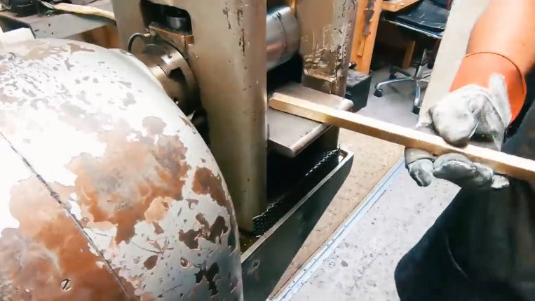 stretching gold bar to make chain